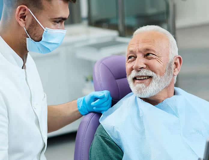 An old man consulting with implant dentist Las Vegas